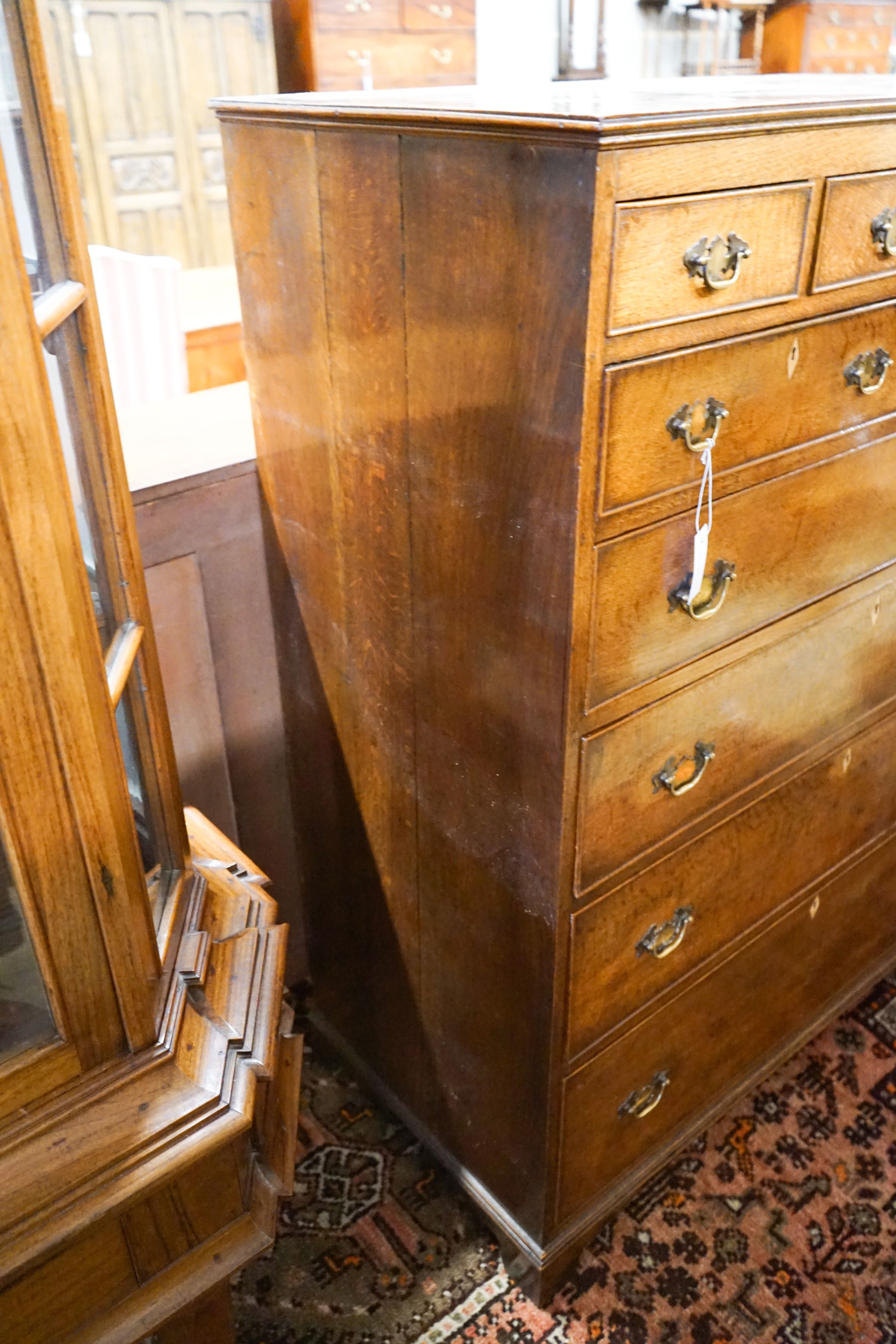 A George IV tall oak chest of drawers, width 107cm, depth 54cm, height 141cm